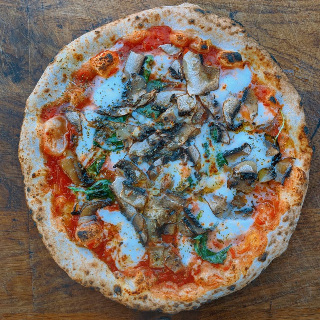 Picture of a wood fired portobello pizza 